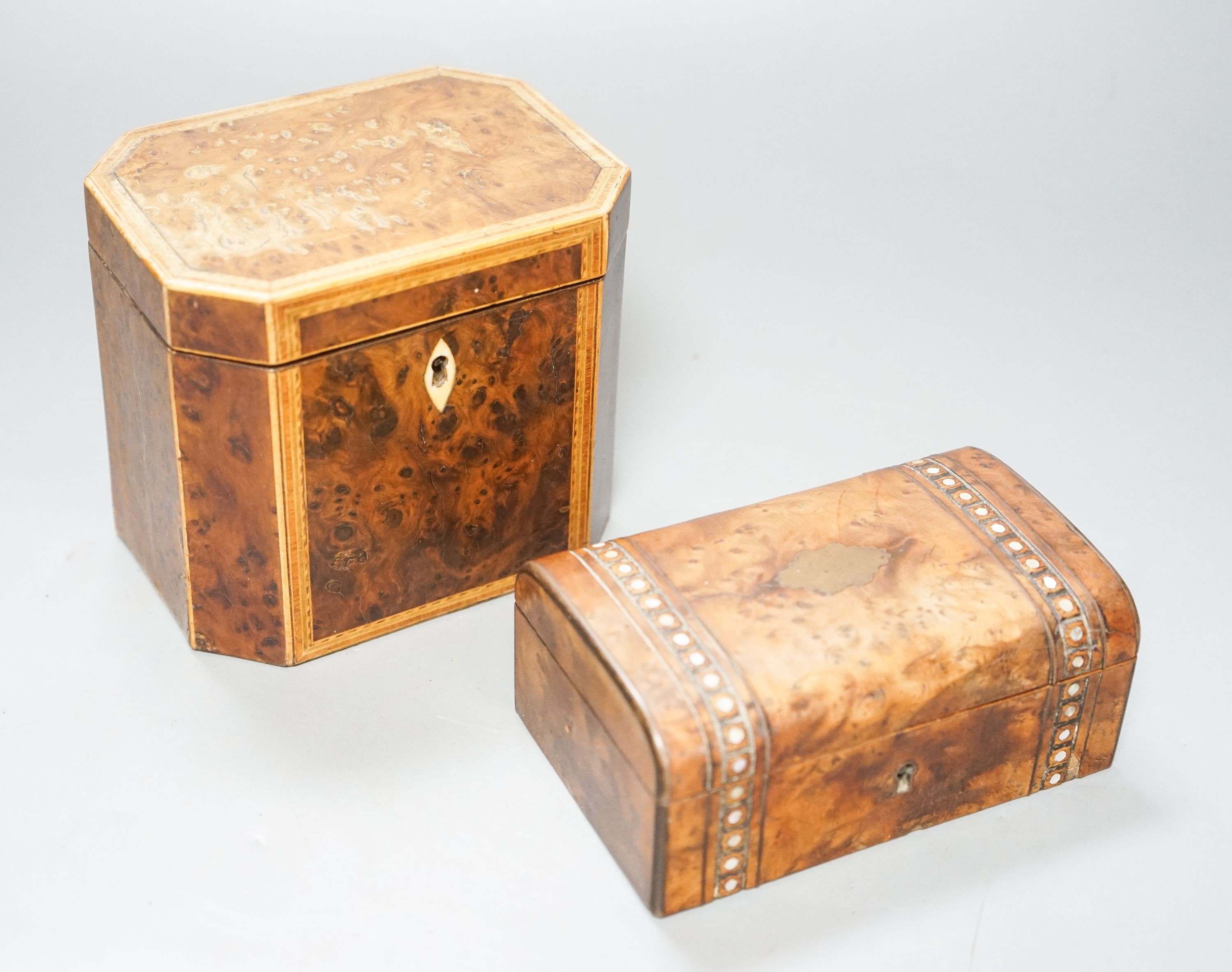 A George III burr yew and harewood, tulipwood and boxwood strung tea caddy, of octagonal form, 12.5cm and a small French yew jewellery casket